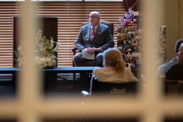 The Rev. Michael McCullar officiates a memorial service for Jonathan Erik Locke in Peachtree Corners on Saturday, July 27, 2024. (Ben Gray for the AJC)