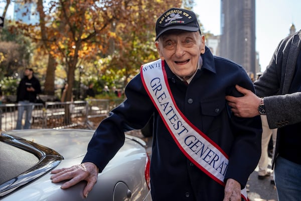 World War II Army Air Corps veteran Walter Rybarczik, 103, is helped to a car before the annual Veterans Day Parade, Monday, Nov. 11, 2024, in New York. (AP Photo/Adam Gray)