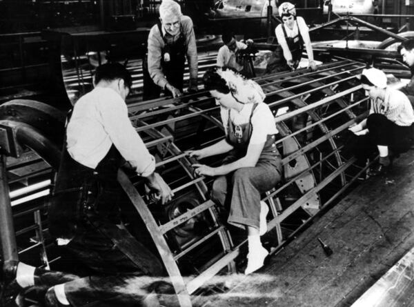 Atlanta's version of 'Rosie the Riveter' works on a B-29 fuselage during World War II at the Bell Bomber Plant (now Lockheed) in Marietta. 1940s AJC file photo