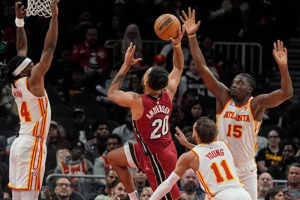 Miami Heat forward Kyle Anderson (20) drives against the Atlanta Hawks during the first half of an NBA basketball game, Monday, Feb. 24, 2025, in Atlanta. (AP Photo/Mike Stewart)