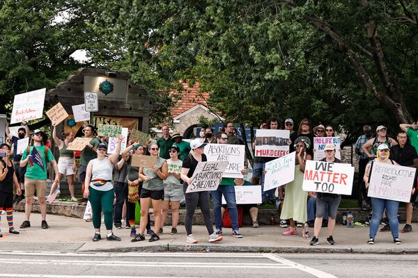 Bans Off Our Bodies activists hold an abortion rights rally on the corner of 10th St. and Monroe Dr. near Piedmont Park in Atlanta on Monday, July 4, 2022. (Natrice Miller/natrice.miller@ajc.com)