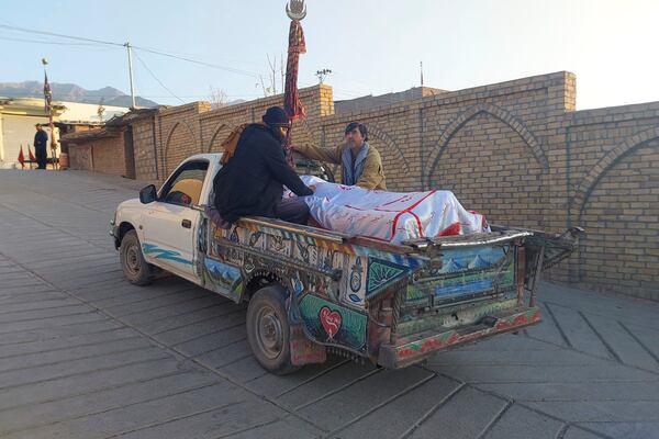 Relatives transport the body of a victim of a gunmen firing incident, after collecting it from a hospital, in Parachinar, main town of Kurram district of Pakistan's northwestern Khyber Pakhtunkhwa province, Friday, Nov. 22, 2024. (AP Photo/Hussain Ali)