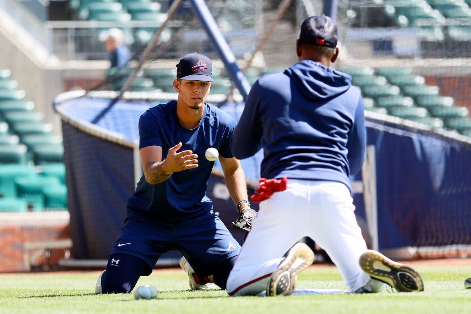 Braves third base coach Ron Washington (right) helps shortstop Vaughn Grissom with a drill during warm-ups before the game against the Astros at Truist Park, Sunday, April 23, 2023, in Atlanta. Miguel Martinez / miguel.martinezjimenez@ajc.com 