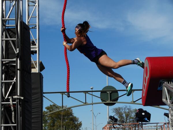 Janice McLean, a Sterling, VA crossfit coach, tries out the course. CREDIT: Rodney Ho/ rho@ajc.com