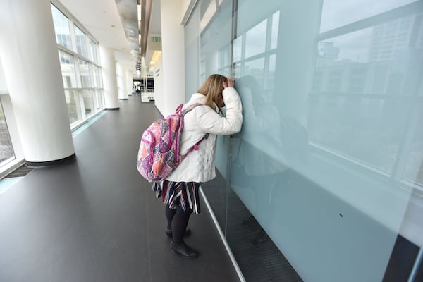 Alex Goodman checks a classroom as she arrives early for a course at Georgia Tech’s Scheller College of Business. She is graduating from the EXCEL program offered by the Georgia Institute of Technology. The four-year college program is for students with intellectual disabilities. 