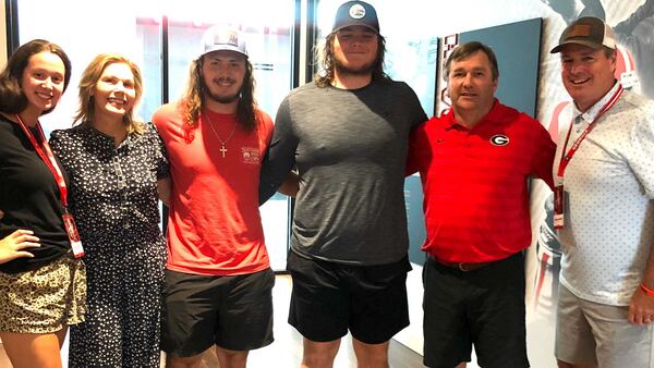 Grayson offensive lineman Griffin Scroggs (center) and his family pose with Georgia coach Kirby Smart (second from right) during his recruiting visit to the UGA campus July 31, 2021. (Photo courtesy of Griffin Scroggs)