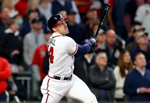 Braves center fielder Adam Duvall hits a grand slam home run to put the Braves up 4-0 during the first inning against the Houston Astros in game 5 of the World Series at Truist Park, Sunday, October 31, 2021, in Atlanta. Curtis Compton / curtis.compton@ajc.com