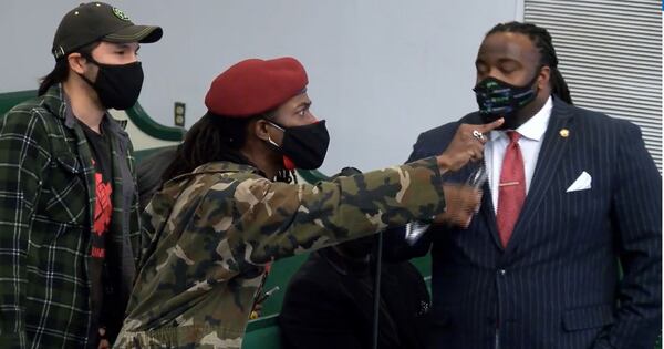 Black Hammer Party leader Gazi Kodzo, whose real name is Augustus Romain Jr., shouts at members of the Atlanta City Council during a February 2022 town hall to discuss the MARTA's transportation plans for Campbellton Road.