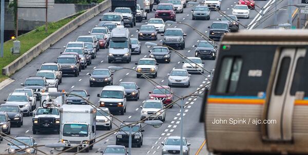 Memorial Day travelers hit the road early Friday on I-85 just north of downtown Atlanta. JOHN SPINK / JSPINK@AJC.COM