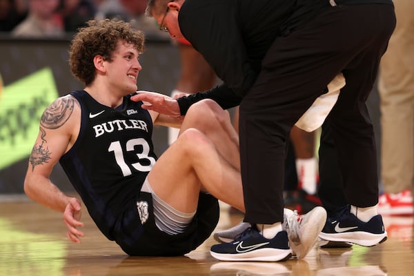 Butler guard Finley Bizjack (13) reacts to an apparent injury during the second half of an NCAA college basketball game against St. John's in the quarterfinals of the Big East Conference tournament, Thursday, March 13, 2025, in New York. (AP Photo/Pamela Smith)