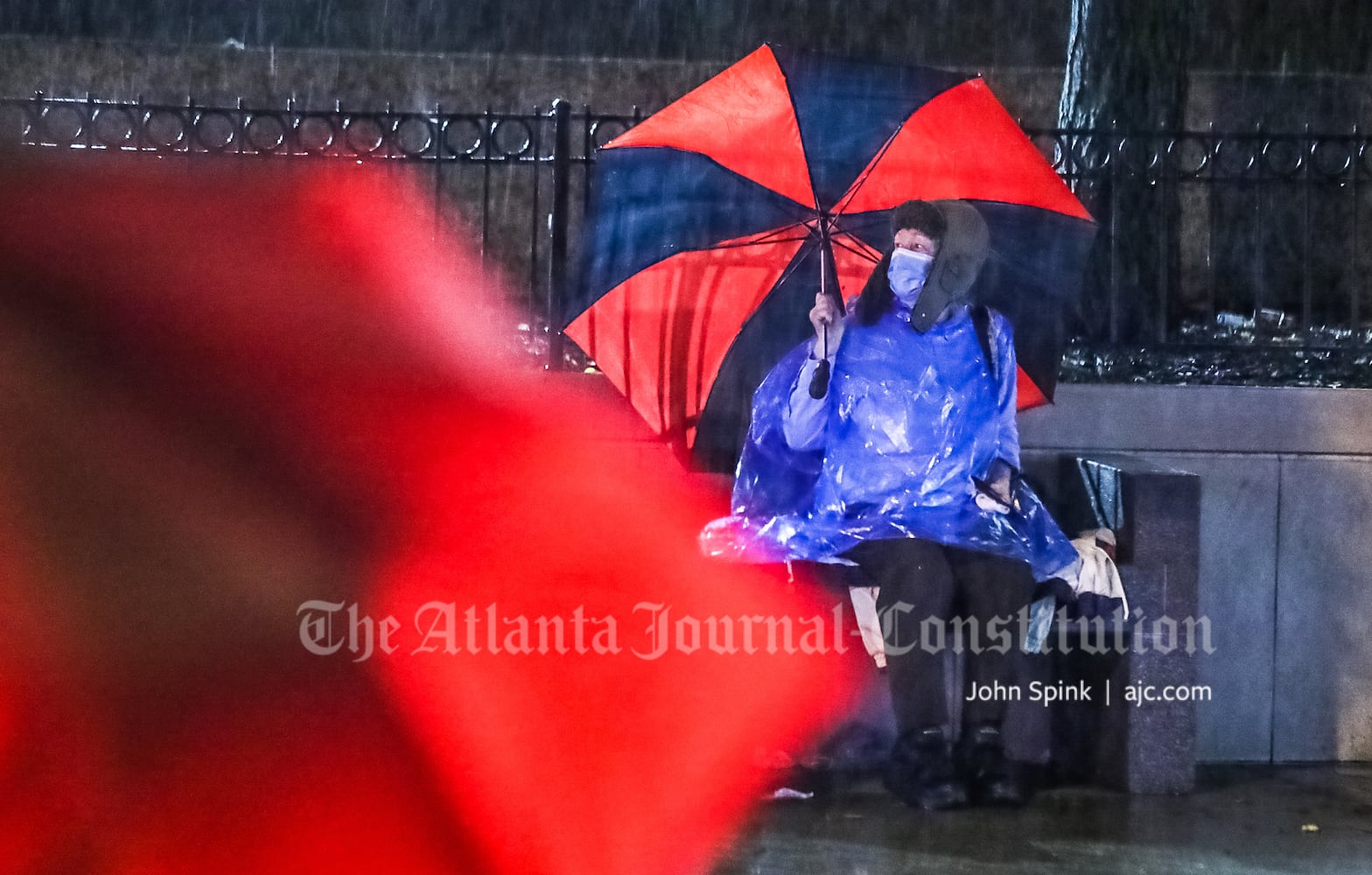 Glenn Gilley waits for a bus on Alabama Street downtown