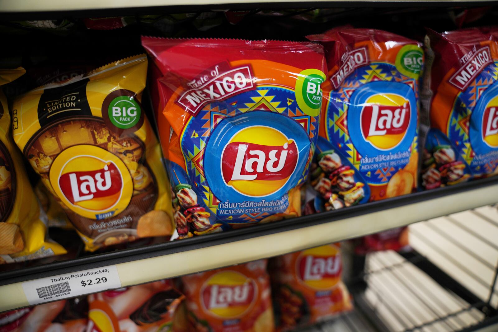 Lays chips with Thai writing and Mexican-style flavors are displayed for sale at Top Asian Food and Deli in Worthington, Minn., on Saturday, Oct. 19, 2024. (AP Photo/Jessie Wardarski)