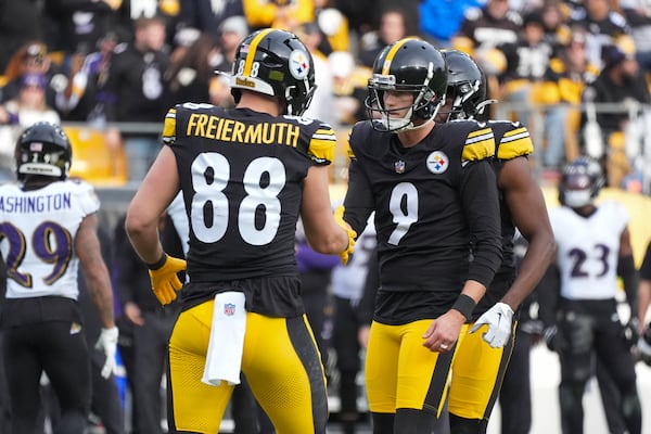 Pittsburgh Steelers kicker Chris Boswell (9) reacts with teammate Pat Freiermuth (88) after kicking a field goal against the Baltimore Ravens during the first half of an NFL football game, Sunday, Nov. 17, 2024, in Pittsburgh. (AP Photo/Gene J. Puskar)