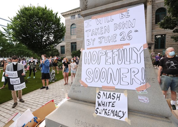 061720 Decatur: Local residents and protesters hold a rally calling on DeKalb County to follow a judgeâs order to âswiftlyâ remove the Confederate monument from Decatur Square on Wednesday, June 17, 2020, in Decatur. In an order issued Friday afternoon, DeKalb County Superior Court Judge Clarence Seeliger said the monument to the Confederacy in the square should be relocated by midnight on June 26. The city argued that the 30-foot obelisk had become a threat to public safety during recent protests about racism and police violence toward black people. Seeligerâs order says the monument should be placed into storage until further notice.    Curtis Compton ccompton@ajc.com