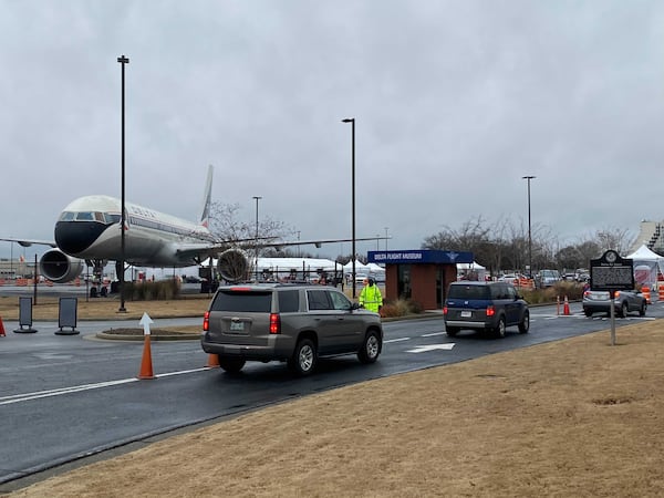 Motorists lined up at the Delta Flight Museum near Harstfield-Jackson International Airport Monday morning to receive the COVID-19 vaccine as Georgia opened its first four vaccination sites. (Adrianne Murchison/AJC)