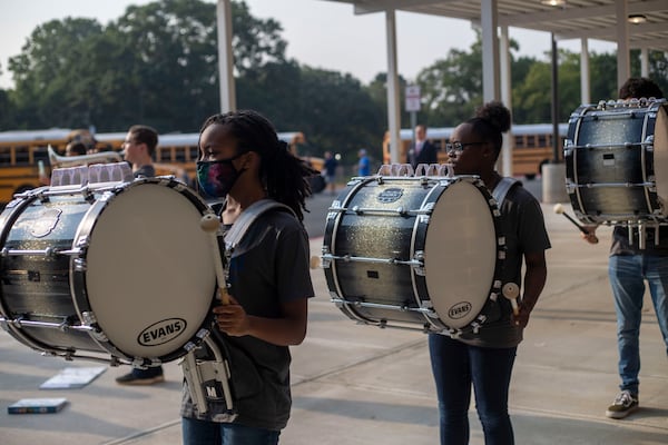 Members of the Campbell High School marching band welcome Pearson Middle School students with a performance during the first day of school at Pearson Middle School in Marietta, Monday, August 2, 2021. (Alyssa Pointer/Atlanta Journal Constitution)