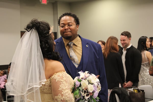 Kevin and Lisa Renee Lloyd exchange vows during the Valentine's Day group wedding in Cobb County Magistrate Court on Friday, Feb. 14, 2025. (Taylor Croft/Taylor.Croft@ajc.com)