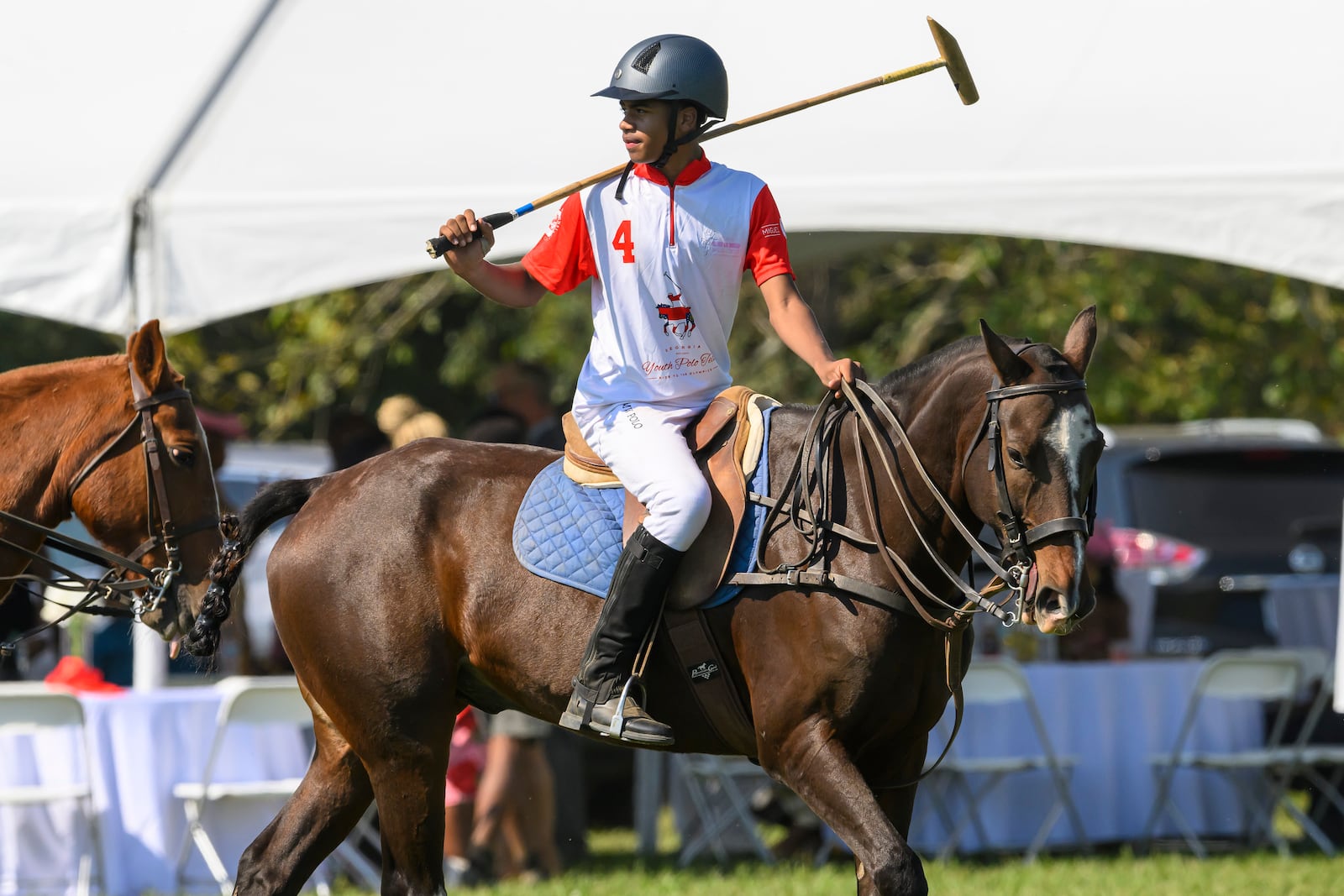 B.E.S.T. Academy polo player Quinn Ramsey warms up before his match at the 7th Annual Atlanta Fashion and Polo Classic on Sunday, Oct. 13, 2024, in Fairburn, GA. (Jim Blackburn for the AJC)