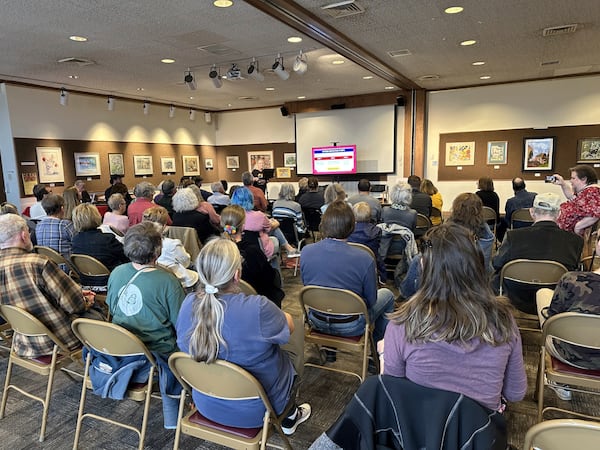 Dozens of people listen to a presentation from the Respect Voters Coalition during a town-hall forum at the Missouri River Regional Library in Jefferson City on Saturday, March 15, 2025. (AP Photo/David A. Lieb)