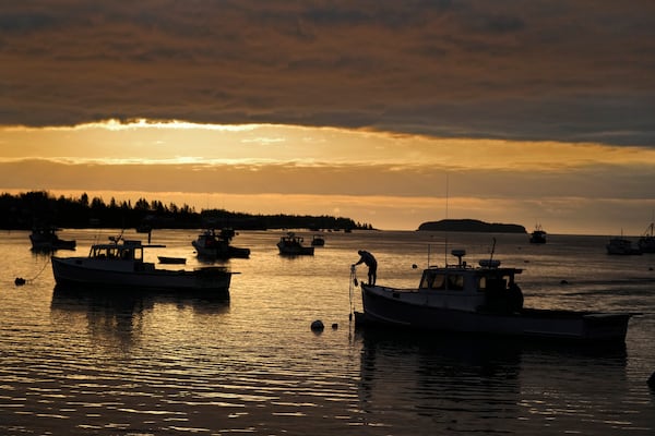 FILE- A lobstermen unties his boat before heading out to fish in Jonesport, Maine, April 27, 2023. (AP Photo/Robert F. Bukaty, files)