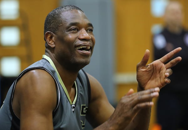 May 20, 2017, Atlanta: Dikembe Mutombo cheers on his teammates during the Breakthrough Atlanta Celebrity Basketball Game at the Lovett School on Saturday, May 20, 2017, in Atlanta.     Curtis Compton/ccompton@ajc.com