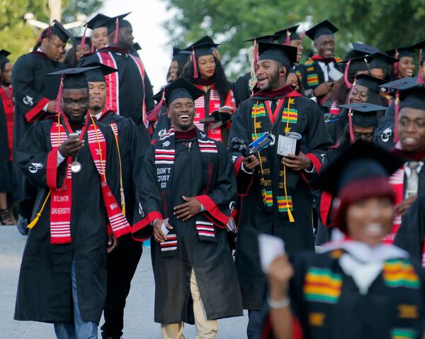 5/22/17 - Atlanta - Graduates walk from the student center to the stadium for graduation.  Clark Atlanta University's Panther Stadium was the site of their 28th annual Commencement.  Businessman William Pickard gave the commencement address.   Rev. Jesse Jackson, who received an honorary degree, also spoke.   Panther Stadium,  BOB ANDRES  /BANDRES@AJC.COM