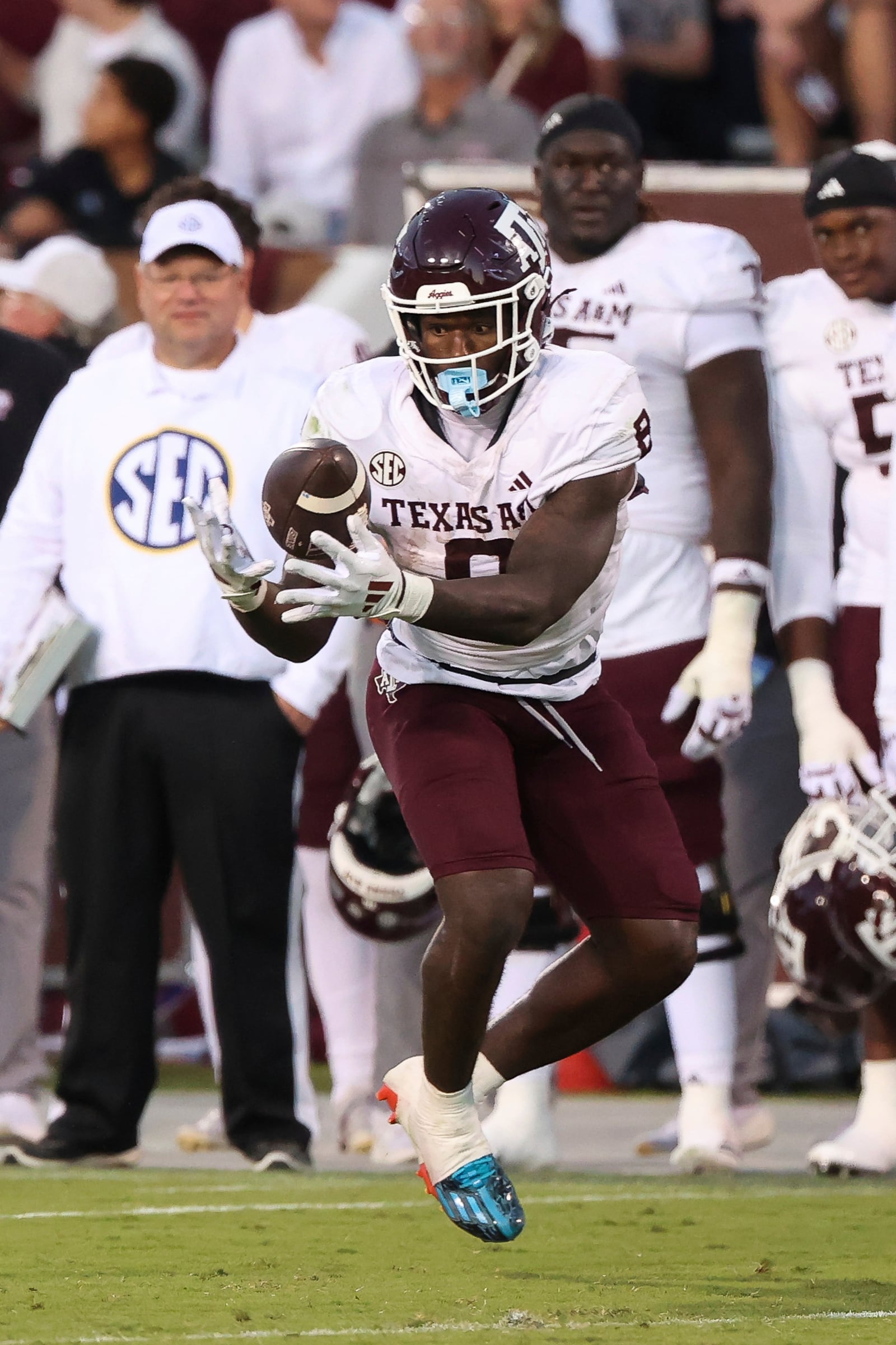 Texas A&M running back Le'Veon Moss (8) catches the ball during the second half of an NCAA college football game against Mississippi State, Saturday, Oct. 19, 2024, in Starkville, Miss. (AP Photo/Randy J. Williams)