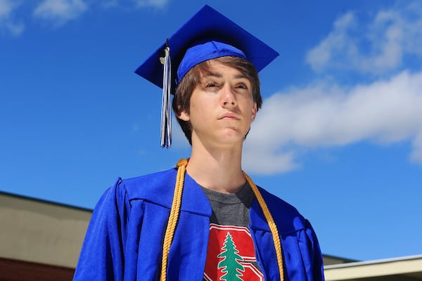 Ethan Asher poses for a portrait on Tuesday, June 16, 2020, at Centennial High School in Roswell, Georgia. Thousands of K-12 schools and colleges closed in the middle of the spring semester this year due to the coronavirus pandemic. For high school and college seniors, the closure not only meant the end of in-person classes, but also no traditional senior rituals like prom and graduation. 