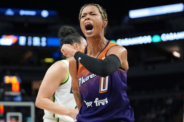 FILE - Phoenix Mercury guard Natasha Cloud (0) celebrates after making a shot while fouled during the first half of a WNBA basketball game against the Minnesota Lynx, Friday, May 31, 2024, in Minneapolis. (AP Photo/Abbie Parr, File)