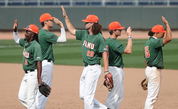 Florida A&M players celebrate defeating Grambling State 10-8 in the HBCU Baseball Classic final Sunday, March 14, 2021, at Coolray Field in Lawrenceville. The Atlanta Braves hosted the inaugural  Ralph Garr-Bill Lucas HBCU Baseball Classic between two historically black colleges and universities in honor of the Braves greats and HBCU graduates. (Curtis Compton / Curtis.Compton@ajc.com)