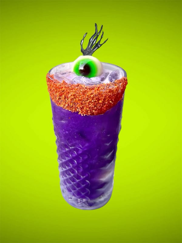 A gummy eyeball is a ghoulish garnish on Rreal Tacos' zombie punch. (Courtesy of Brandon Amato)