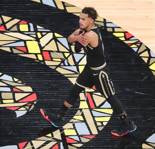 Hawks guard Trae Young gives himself a hug after hitting a three pointer against the New York Knicks during a 113-96 victory in Game 4 of their first-round NBA playoff series Sunday, May 30, 2021, at State Farm Arena in Atlanta. (Curtis Compton / Curtis.Compton@ajc.com)