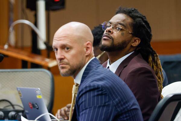 Shannon Stillwell (center back) sits with his attorney, Max Schardt (left), as he looks at the prosecutors during the YSL trial at Fulton County Courthouse in Atlanta on Tuesday, November 26, 2024. The longest trial in Georgia's history is nearing its end as the jury starts deliberations.
(Miguel Martinez / AJC)