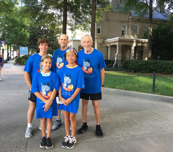 Jere Allen (right) with his son Bill (center) and Jere's grandchildren -- (from left) Tripp, Sophie and Kate -- after the AJC Peachtree Road Race in 2021.
(Courtesy of Bill Allen)