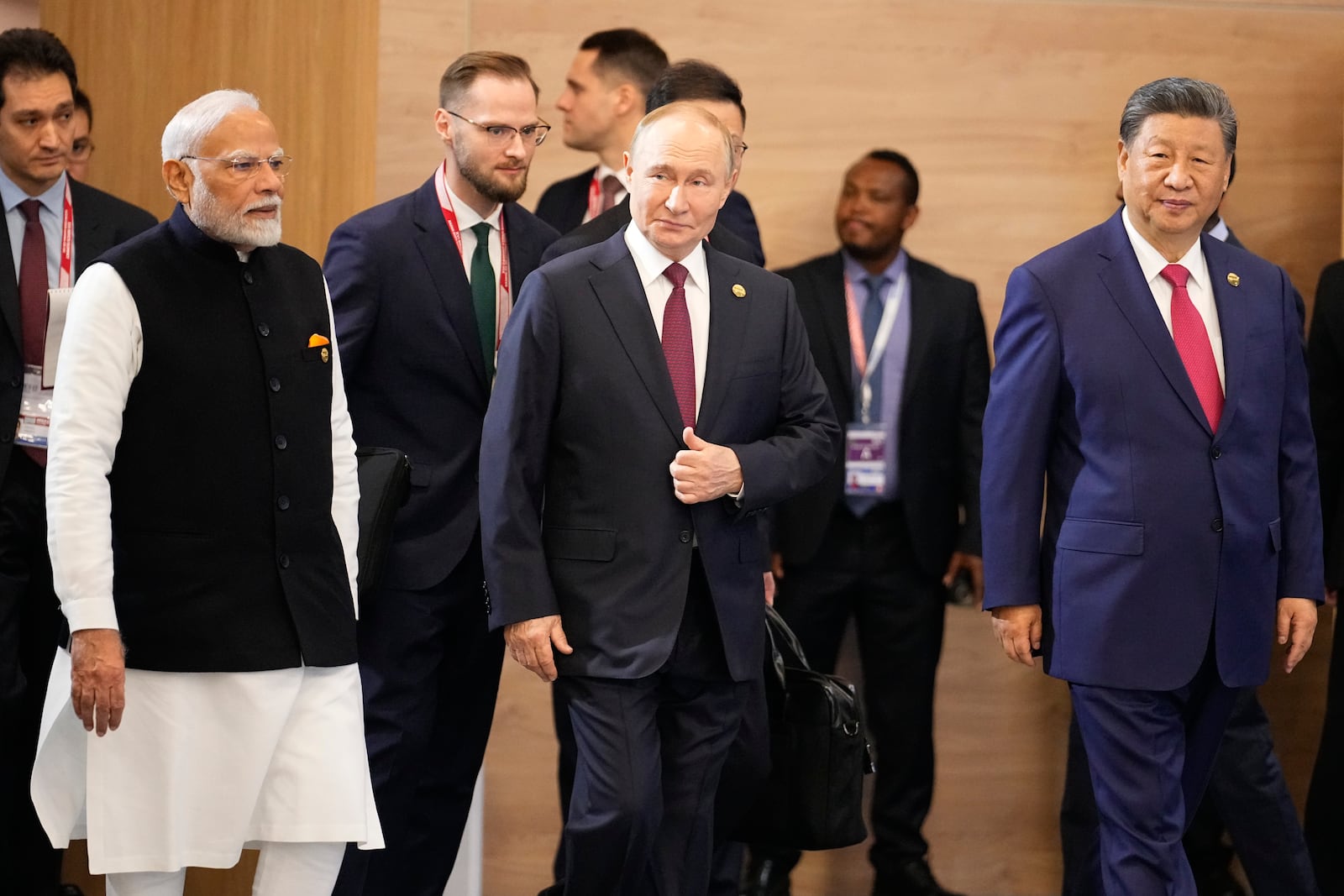 From left, Indian Prime Minister Narendra Modi, Russian President Vladimir Putin and Chinese President Xi Jinping attend a family photo ceremony prior to the BRICS Summit plenary session in Kazan, Russia, Wednesday, Oct. 23, 2024. (AP Photo/Alexander Zemlianichenko, Pool)