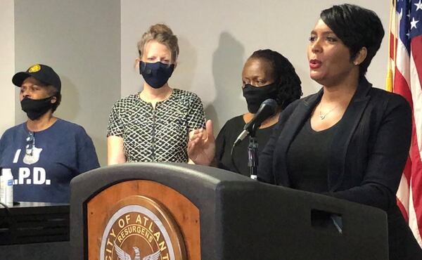 Atlanta Mayor Keisha Lance Bottoms, right, speaks during a press conference at Atlanta police headquarters about the Saturday night shooting death of 8-year-old Secoriea Turner. J. SCOTT TRUBEY/SCOTTl.TRUBEY@AJC.COM