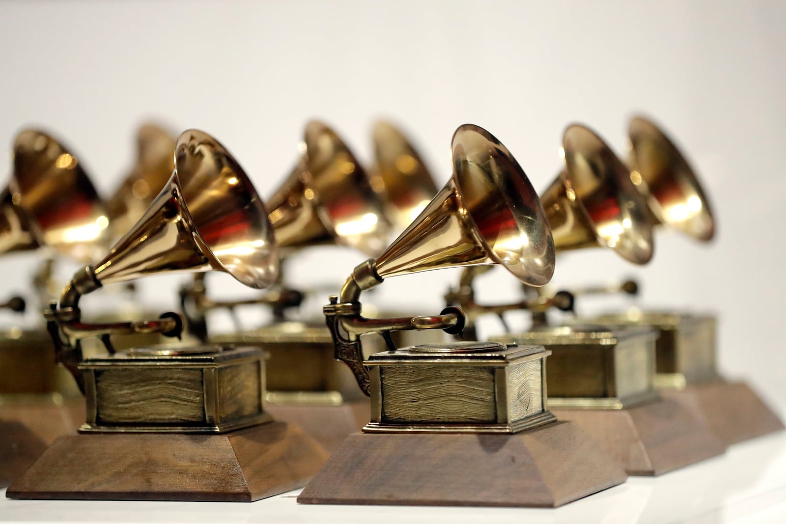 FILE - Grammy Awards are displayed at the Grammy Museum Experience at Prudential Center in Newark, N.J. on Oct. 10, 2017. (AP Photo/Julio Cortez, File)