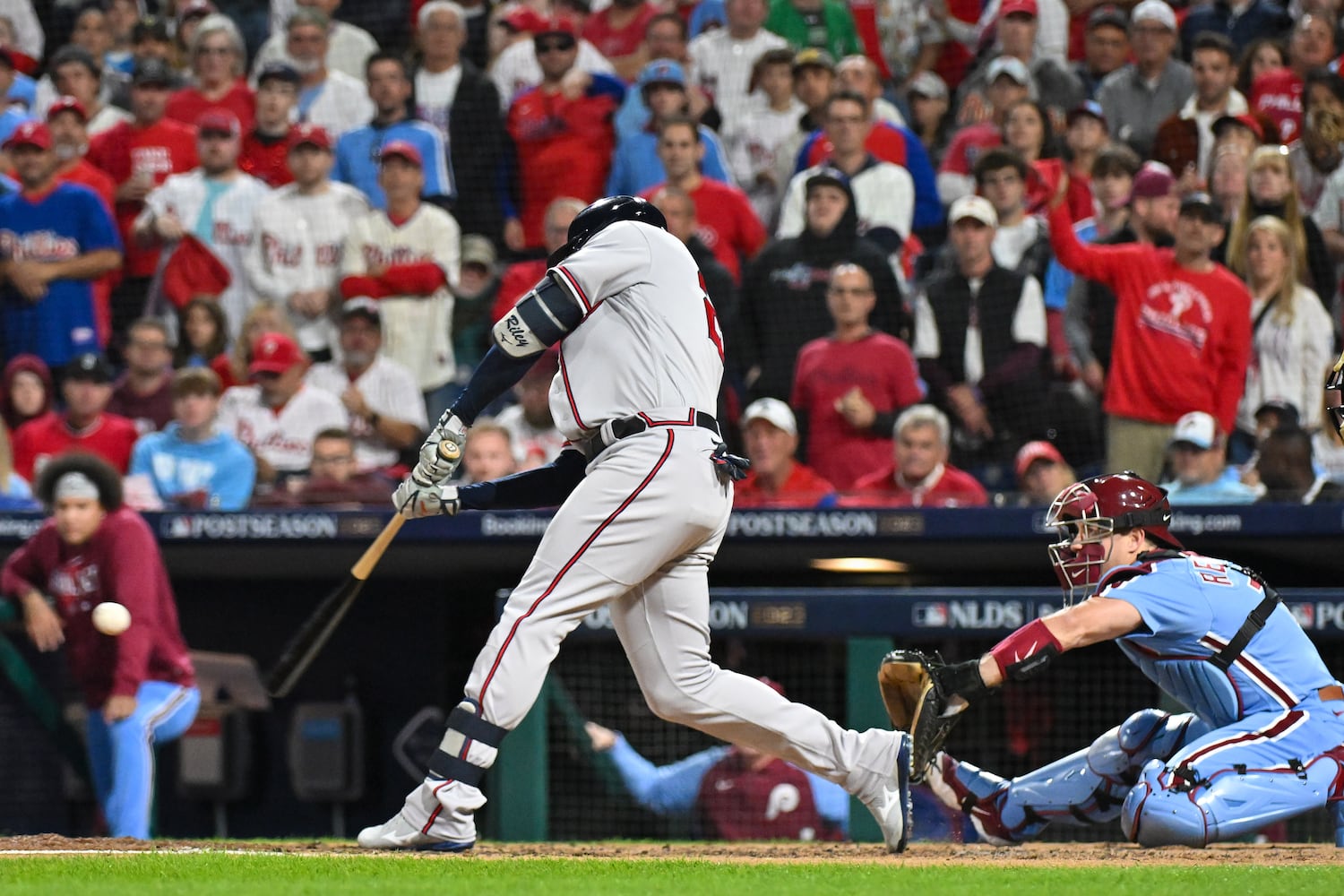 Atlanta Braves’ Austin Riley (27) hits a solo home run against the Philadelphia Phillies during the fourth inning of NLDS Game 4 at Citizens Bank Park in Philadelphia on Thursday, Oct. 12, 2023.   (Hyosub Shin / Hyosub.Shin@ajc.com)