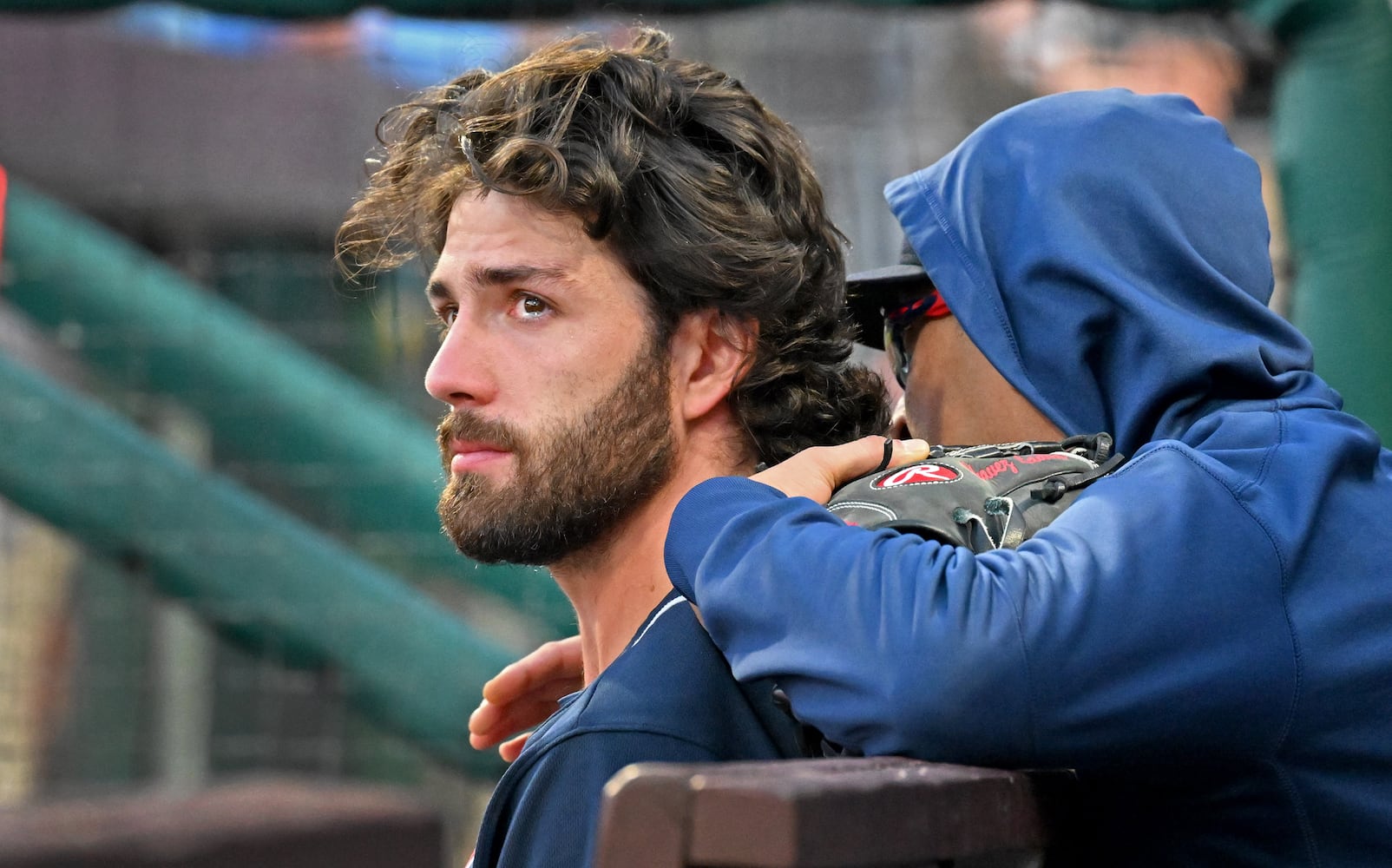 Braves shortstop Dansby Swanson is emotional in the dugout as the Phillies celebrate their 8-3 win Saturday. (Hyosub Shin / Hyosub.Shin@ajc.com)