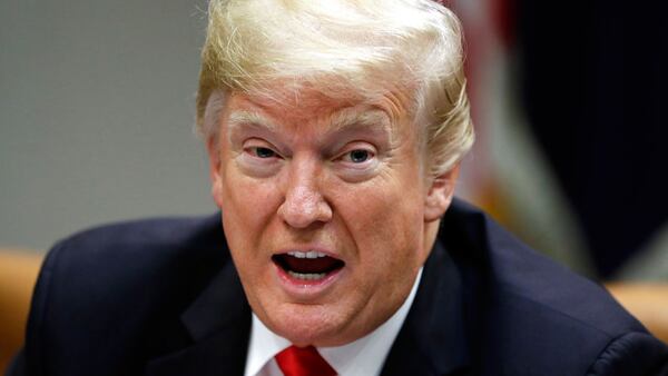 President Donald Trump speaks in the Roosevelt Room of the White House, Tuesday, Dec. 18, 2018, in Washington.  He signed an executive order to give all federal employees Christmas eve off.