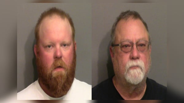 This photo combo of images taken Thursday, May 7, 2020, and provided by the Glynn County Detention Center in Georgia, shows Travis McMichael (left) and his father Gregory McMichael. The two have been charged with murder in the February shooting death of Ahmaud Arbery, whom they had pursued in a truck after spotting him running in their neighborhood.