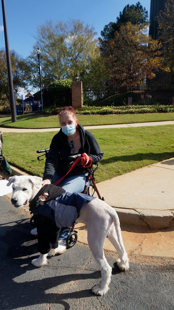 Newly shaven, Oscar and his owner, Brooke Bailey, enjoy the neighborhood party. 
Photo courtesy of Phyllis Perez and Leslie Meadows