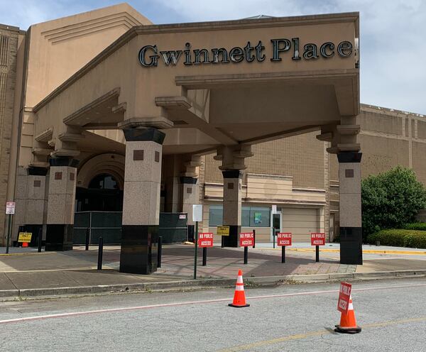 All entrances into Gwinnett Place Mall's interior are blocked off. RODNEY HO/rho@ajc.com