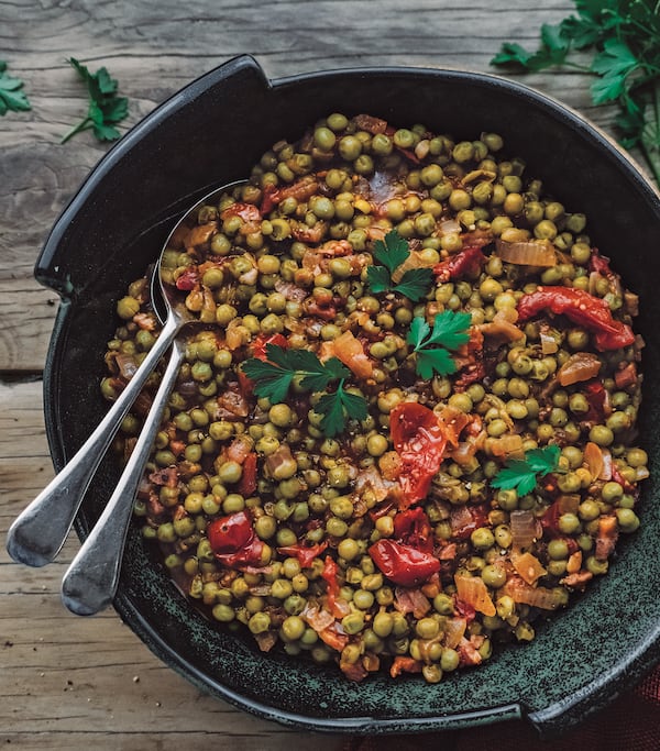 Piselli (braised peas in tomato sauce) from "Frugal Mediterranean Cooking" by Melanie Lionello (Page Street Publishing Co., 2020). (Courtesy of Melanie Lionello)