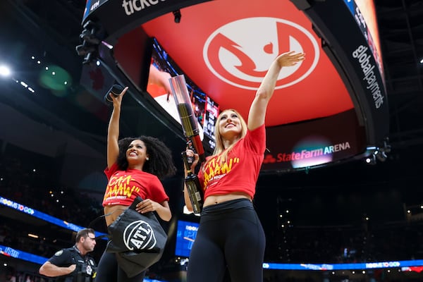 Atlanta Hawks dancers fire T-shirts into the stands during the Hawks’ season opener against the Brooklyn Nets at State Farm Arena, Wednesday, October 23, 2024, in Atlanta. (Jason Getz / AJC)

