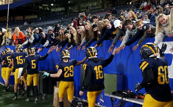 Prince Avenue Christian players celebrate with fans after their 41-21 win against Trinity Christian during the Class 1A Private championship at Monday, Dec. 28, 2020, at Center Parc Stadium in Atlanta. (Jason Getz/For the AJC)






