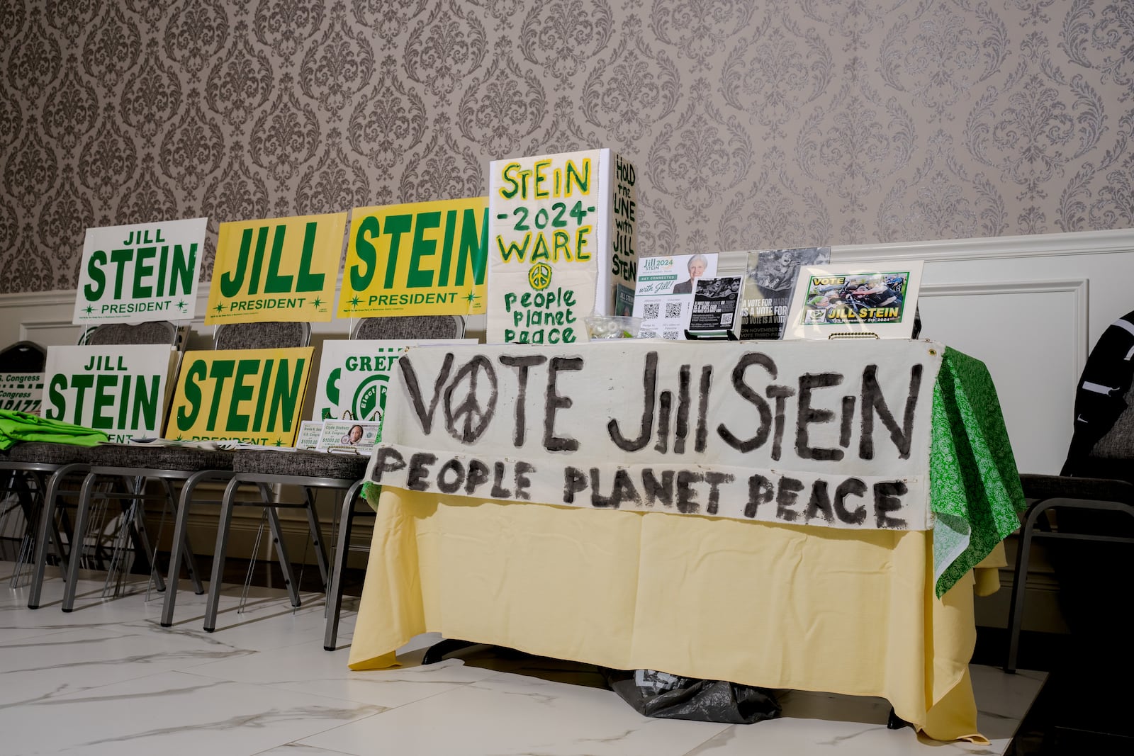 Signs for presidential candidate Jill Stein are displayed at a rally in Michigan.