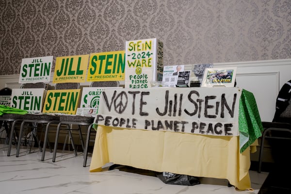 Signs for presidential candidate Jill Stein are displayed at a rally in Michigan.