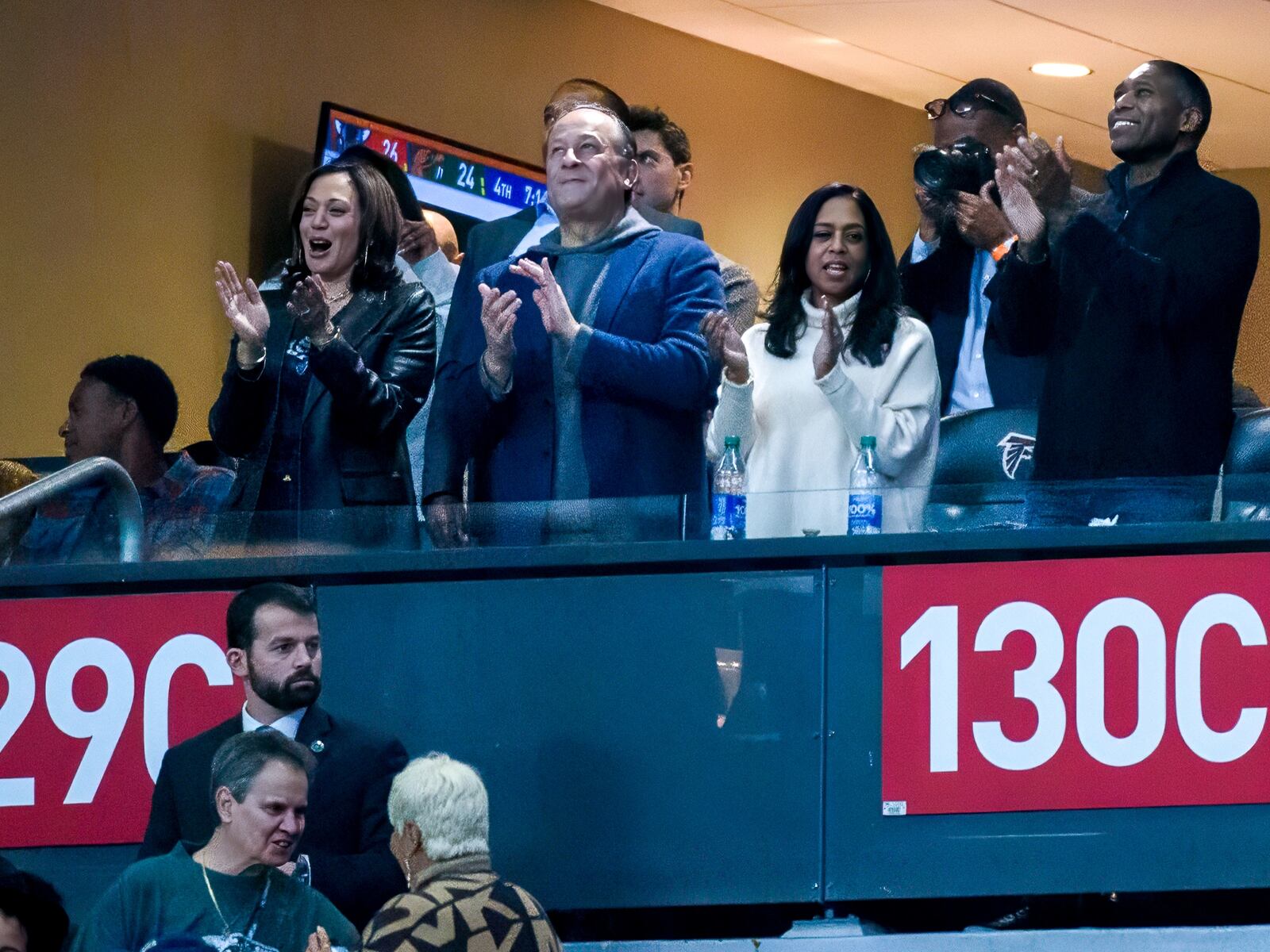 Vice President Kamala Harris, alum of Howard University, celebrates with her husband after Howard scores a touchdown at the Celebration Bowl, Howard University versus Florida A&M, at Mercedes Benz Stadium in Atlanta, Georgia on December 16, 2023. (Jamie Spaar for the Atlanta Journal Constitution)