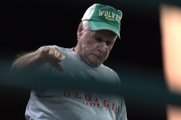 Larry Puckett walks down the bleachers to leave the Buford High School football game. Jenna Eason / Jenna.Eason@coxinc.com